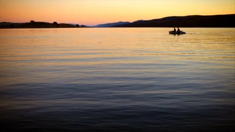 Boat moving through water at sunset. Stock Footage 88407155