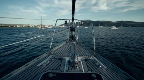 Boat moving towards a harbour Stock Footage 27360324
