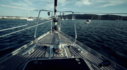 Boat moving towards a harbour Stock Footage 27360330