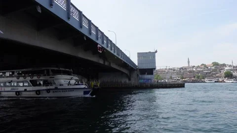 Boat Moving Under Galata Bridge in Istanbul (Turkey) Video stock 196620431