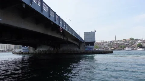 Boat Moving Under Galata Bridge in Istanbul (Turkey) Video stock 196621001