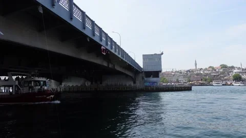 Boat Moving Under Galata Bridge in Istanbul (Turkey) Video stock 196621556