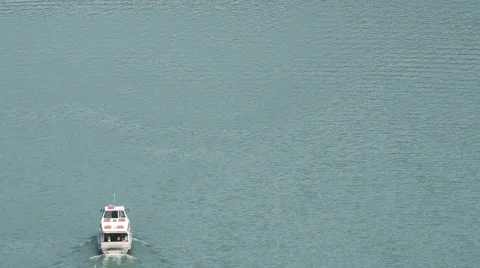 Boat navigates through orta lake in summer day Stock Footage 64541322