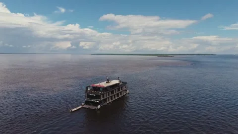 Boat navigating the Amazon river confluence Stock Footage 322114687