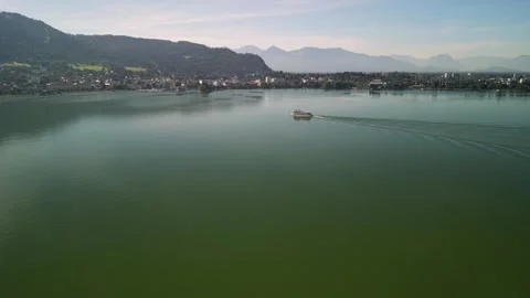 Boat navigating the calm waters of Lake Constance near Bregenz Stock Footage 250260359
