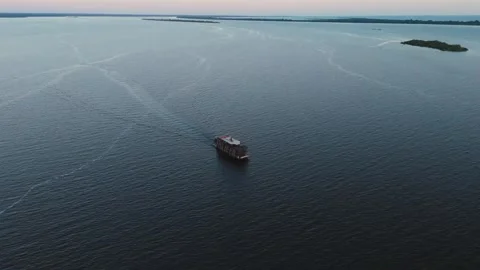 Boat navigating the middle of the Rio Negro – drone view Stock Footage 322114820