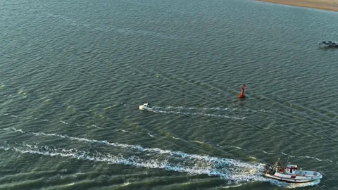 Boat navigating near the coast Stock Footage 263211793