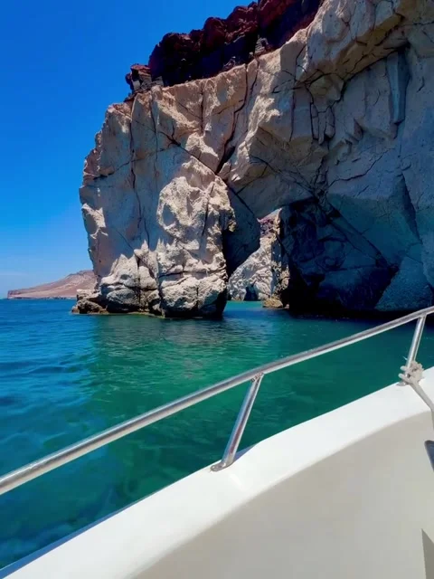 Boat Navigating Through Natural Rock Arch in Turquoise Water Stock-Footage 340564326