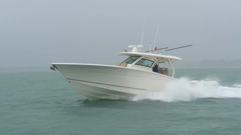 Boat navigating under heavy rain. Stock Footage 89991954