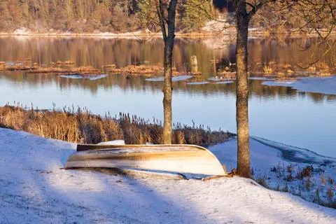 Boat near a river in a winter Stock Photos