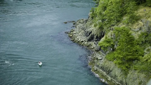 Boat near shore at Deception Pass Bridge State Park Washington Stock Footage 73526680