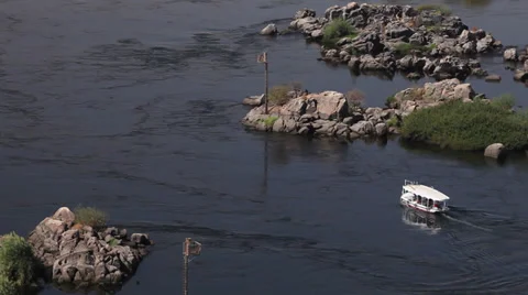 A boat on the Nile river, opposite direction, Aswan, Egypt Stock Footage 34689739