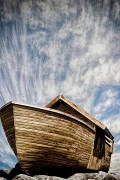 Boat of noah on the rocks cloudscape background portrait image Stock Photos