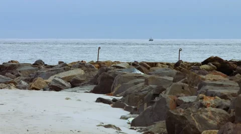 Boat in The Ocean at Beach During The Winter Stock Footage 45369119