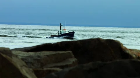 Boat in the Ocean at the Beach During The Winter Stock Footage 45369207