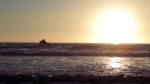 Boat in the Ocean at Sunset Stock Footage 99596500