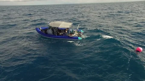 Boat on ocean with waves and ocean's reflection Stock Footage 79683611