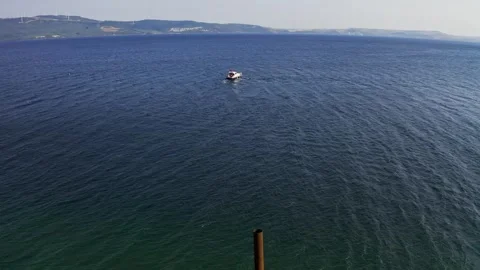 Boat on open sea at sunset Stock Footage 336465171