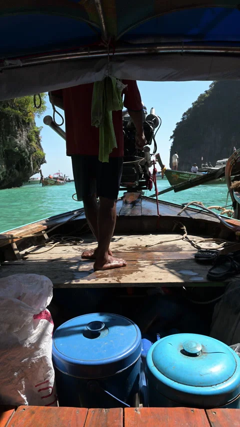 Boat Operator Navigating Tropical Lagoon Beside Longtail Engine Stock Footage 337537952