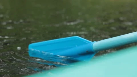 Boat paddle is being used in the forest lake water Stock Footage 133936436