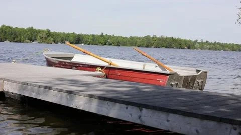 Boat parked against dock Stock Footage 64983101