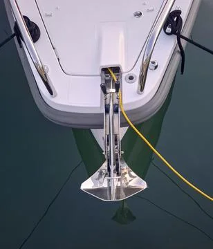 Boat parking device securely fastened with anchor and mooring lines in calm.. 写真素材