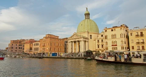 Boat pass by during Venice Sunset in front of Chiesa San Simeon Piccolo Stock Footage 110749986