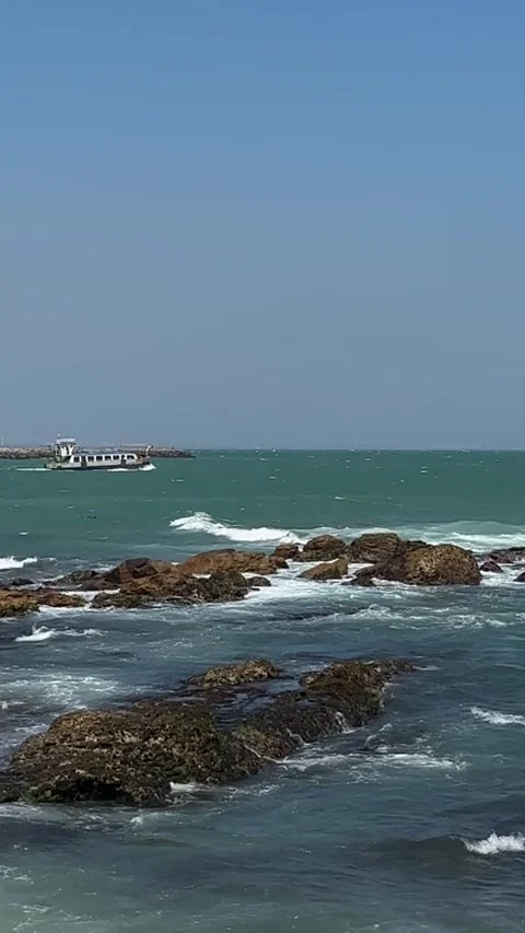 A boat with passengers sails far out to sea Stock Footage 321753179