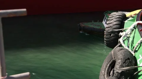 Boat Passes By A Hull Of Ship Stock Footage 63988545