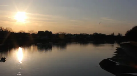 Boat passes through setting sun on the Thames Video stock 22485448
