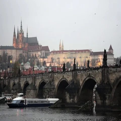 Boat passes under Charles Bridge, Prague Castle, Prague, Czech Republic Stock Footage