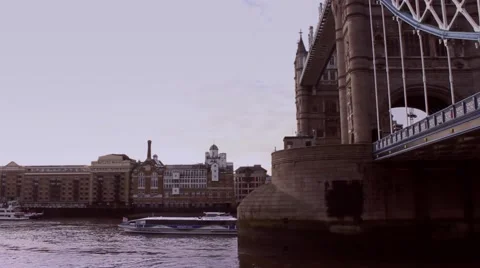 Boat passes under Tower bridge London panning shot Stock Footage 45234469
