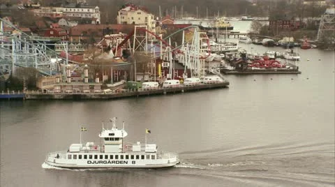 Boat passing by an amusement park, Stockholm Stock Footage