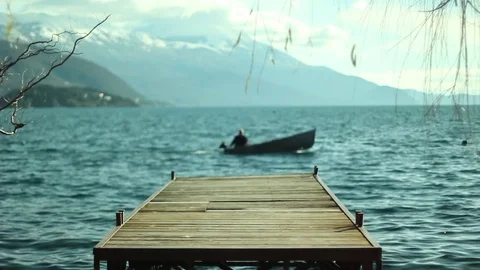 Boat passing left to right in Ohrid lake Stock Footage 84780013