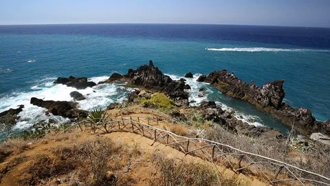 Boat passing Madeira Coastline Stock Footage 82379200