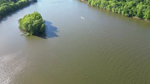 Boat Passing by Mini Island: A 4K Drone View of Gun Island Chute River, Alabama Stock Footage 239959176