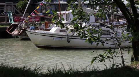 Boat Passing By on river with flags and bunting Stock Footage 34461494