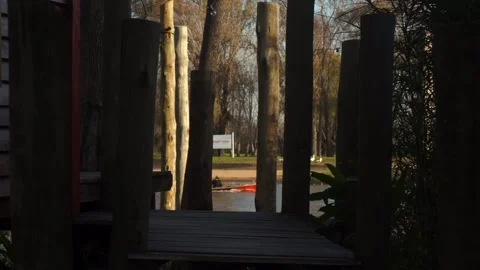 Boat passing by in the river at sunset Stock Footage 196447450