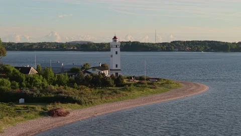 Boat Passing Strib Lighthouse with the New Little Belt Bridge Revealed on the Stock Footage 346689017
