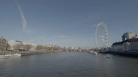Boat passing on the Thamese River in front of London Eye Stock Footage 128164612