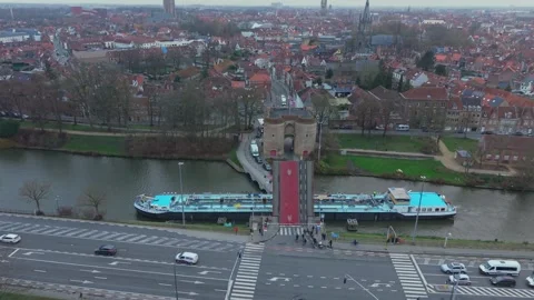 Boat passing through open Gentpoort drawbridge in Bruges Stock Footage 326615594