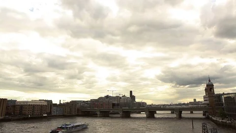 Boat passing under bridge with sky cloudy, London Video stock 76385101