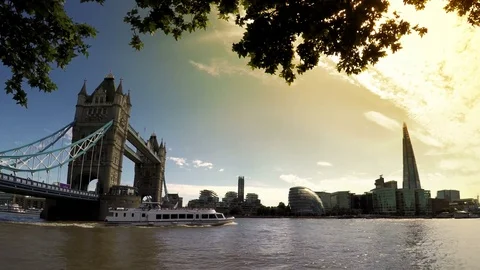 Boat passing under Tower Bridge at sunset in London, UK 스톡 동영상 78872957