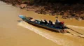 Boat with people floats on the river to the Tonle Sap lake in Cambodia HD Footage
