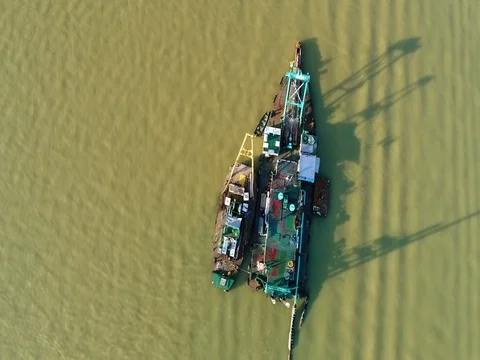 A boat performing dredging work at the harbor. 動画素材 80225281