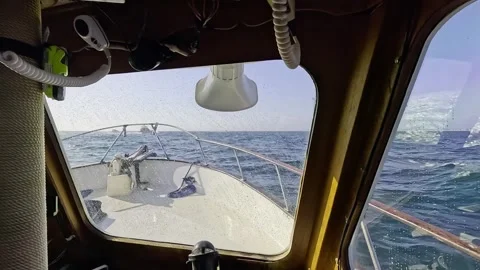 A Boat Pitches and Rolls in Moderately Rough Seas, Wide Angle Pilot POV Stock Footage 288172228