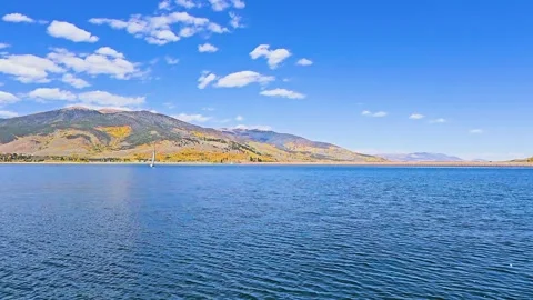 Boat point of view across Dillon Reservoir, Colorado, with calm blue water Stock Footage 345250015