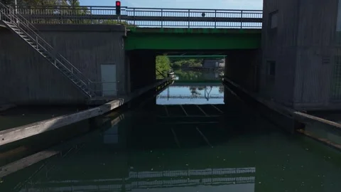 From a boat point of view under movable bridge Motala Stock-Footage 325328922