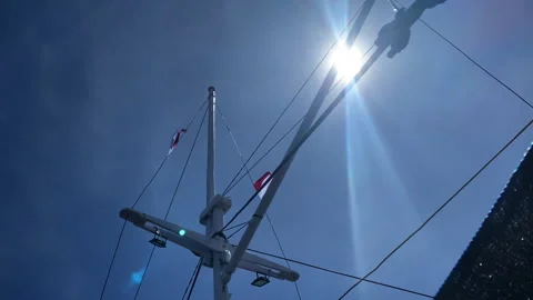 A boat pole on a clear sky sun, low angle bottom shot Stock-Footage 276161149