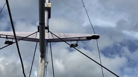 A boat pole on a cloudy sky, low angle bottom shot Stock Footage 276169515